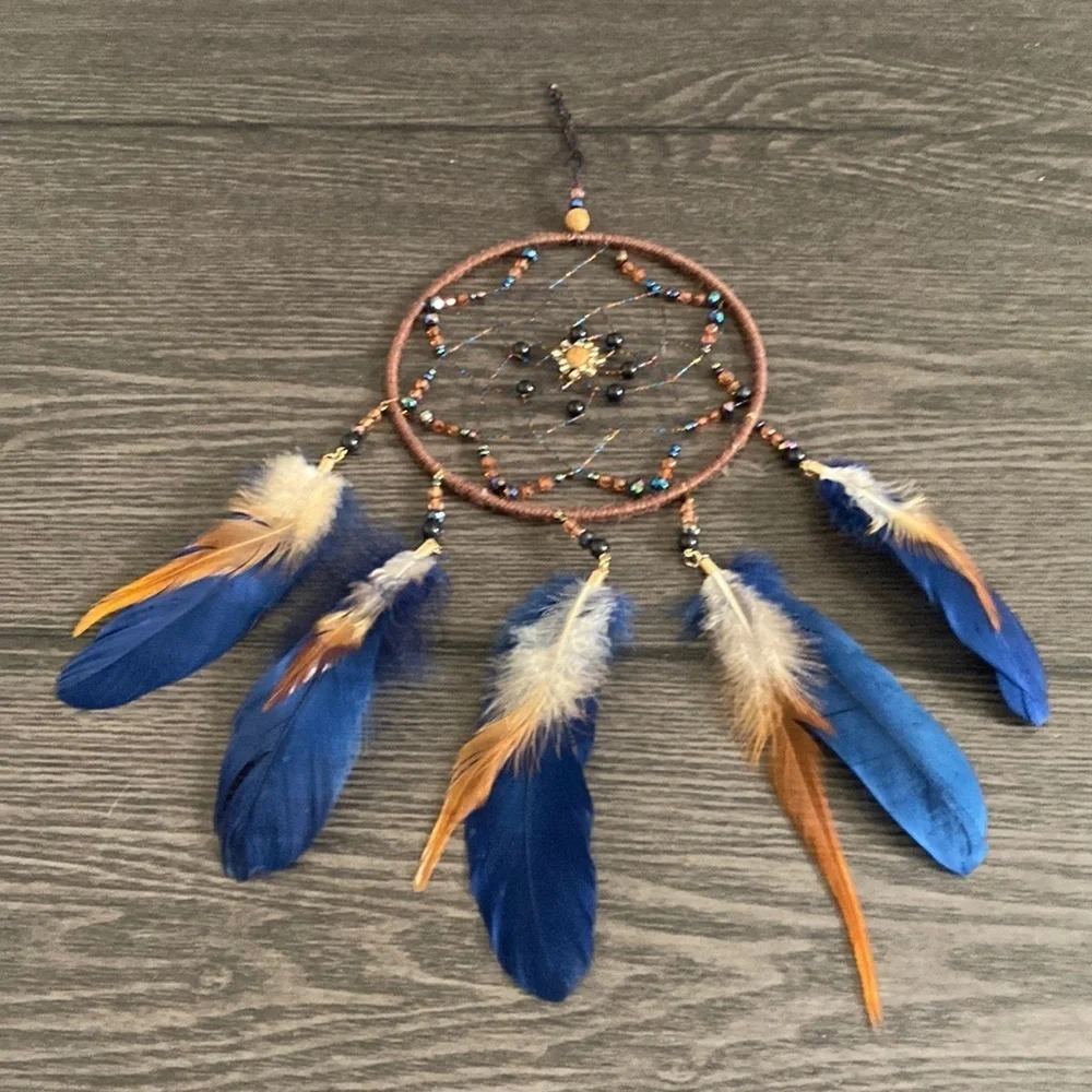 Dream catcher. Blue and tan feathers beaded. Beautiful!